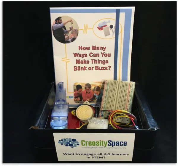 A STEM kit with experimental materials and a student notebook