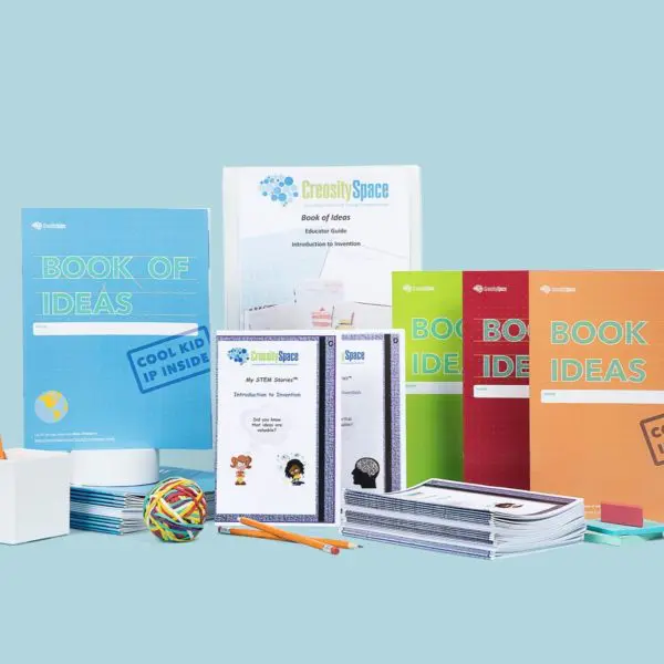 A picture of the contents of the Book of Ideas class pack - a class set of the Book of Ideas, a class set of student notebooks and a lesson guide.