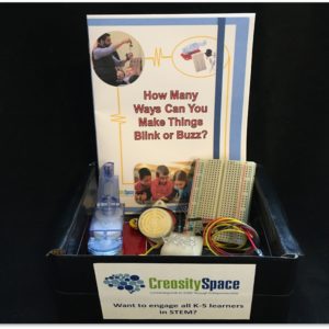 A STEM kit with experimental materials and a student notebook