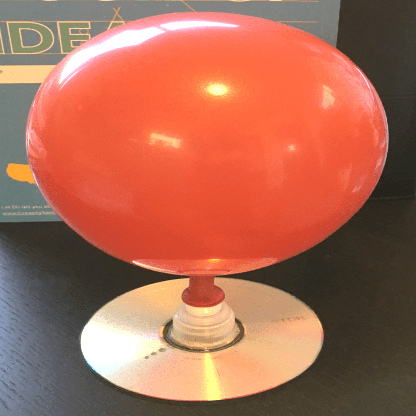 A hovercraft device made with a balloon and a CD